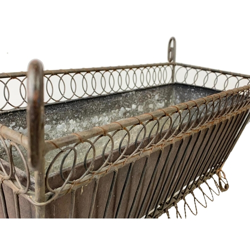 174 - A vintage French 19th century style wrought iron and wire planter. 55.5 x 26 x 29.5cm