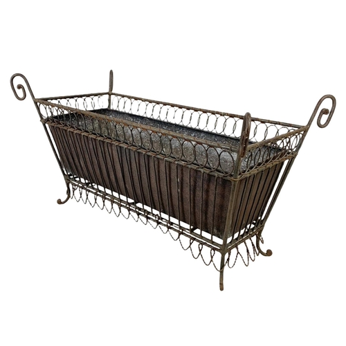 174 - A vintage French 19th century style wrought iron and wire planter. 55.5 x 26 x 29.5cm