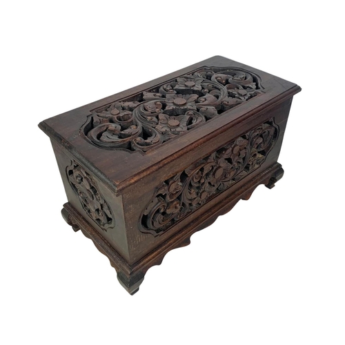 175 - A pair of carved ornate wooden storage boxes. 49 x 25.5 x 29cm.