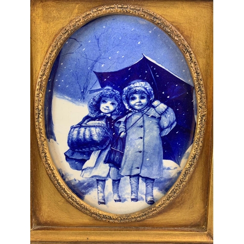 199 - A pair of Carvers & Gilders Picture Makers & Restorers gilt framed blue and white porcelain plaques.... 