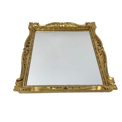 205 - A pair of ornate gilt framed mirrors 26.5 x 31cm