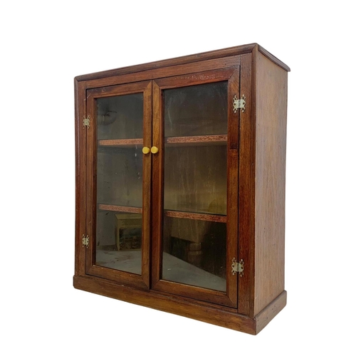 214 - A vintage 2 door cabinet. 63 x 23 x 69cm