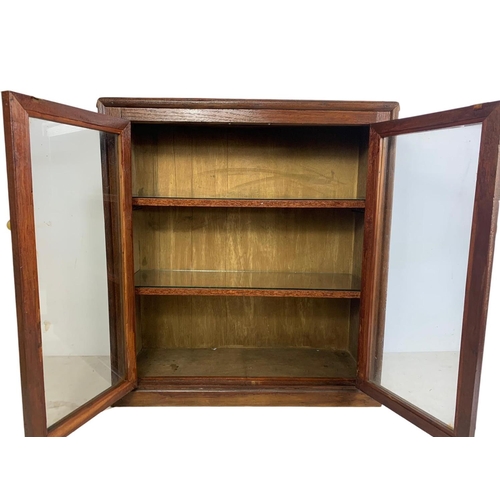 214 - A vintage 2 door cabinet. 63 x 23 x 69cm