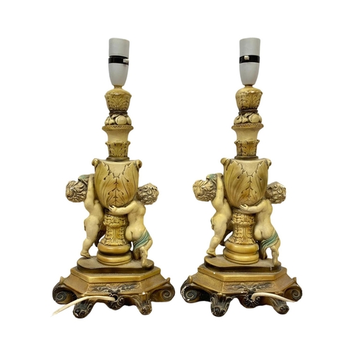 232 - A pair of vintage cherub lamps. 44cm