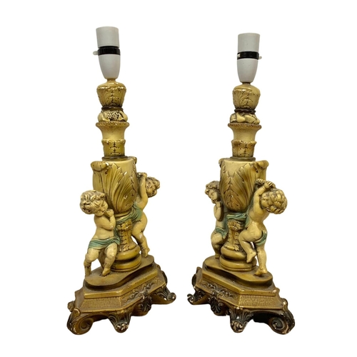 232 - A pair of vintage cherub lamps. 44cm