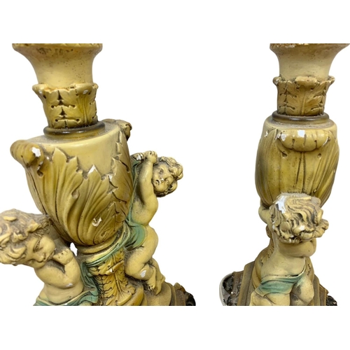 232 - A pair of vintage cherub lamps. 44cm