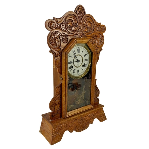 236 - A late 19th century American oak gingerbread clock. Circa 1880. 34 x 57cm.