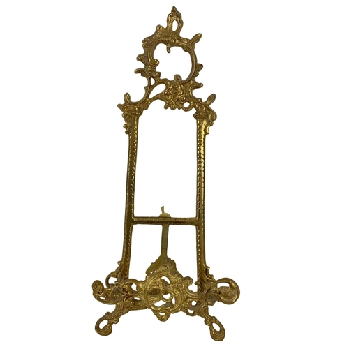 237 - 4 vintage brass cherubs and an ornate brass easel. Cherubs measure 14.5cm. 36cm.