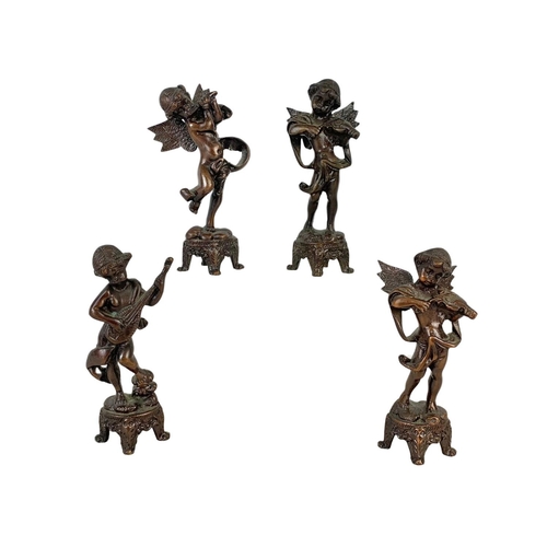 237 - 4 vintage brass cherubs and an ornate brass easel. Cherubs measure 14.5cm. 36cm.