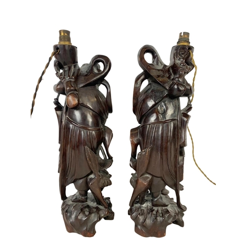 239 - A pair of 1930’s Chinese carved root wood lamps. 47.5cm.