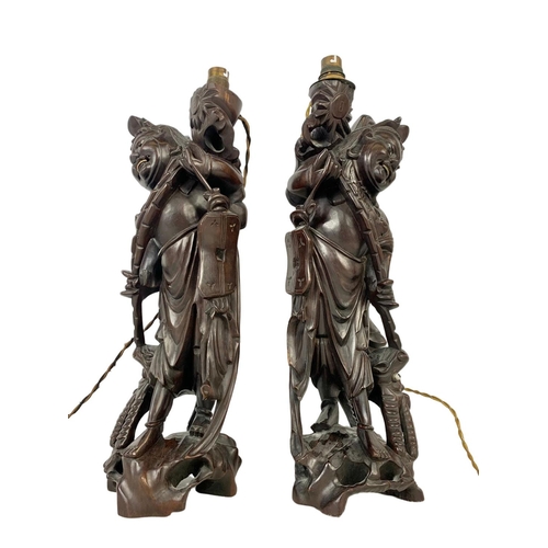 239 - A pair of 1930’s Chinese carved root wood lamps. 47.5cm.