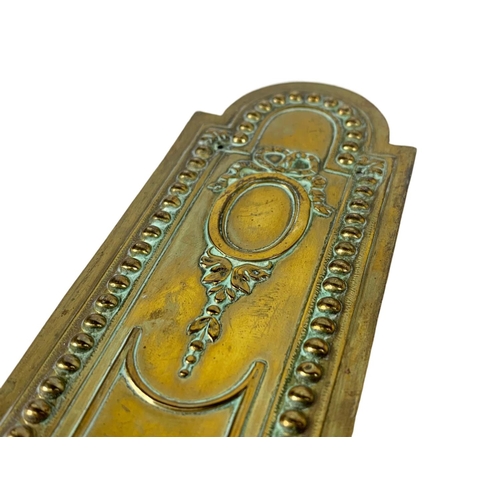 244 - A set of 10 late 19th century French brass door finger plates. Circa 1890/1900. 22cm.