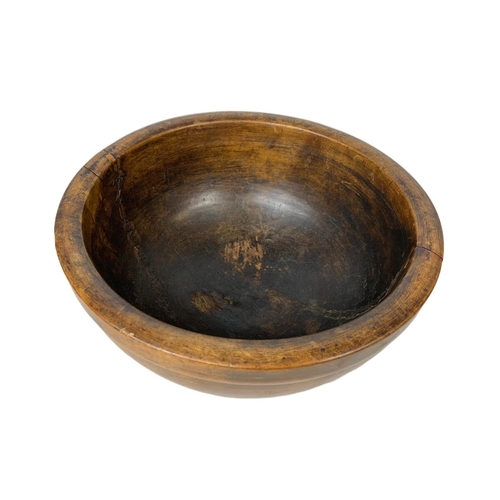 251 - A late 19th century butternut bowl. 30 x 14.5cm.