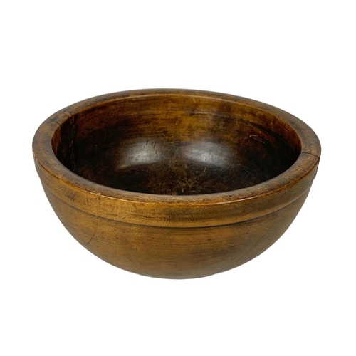 251 - A late 19th century butternut bowl. 30 x 14.5cm.