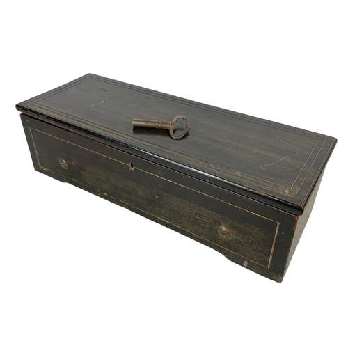 256 - A Victorian music box with key. Case simulating coromandel wood. Circa 1850. 44.5 x 16.5 x 12cm.