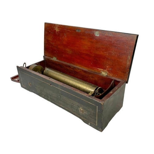 256 - A Victorian music box with key. Case simulating coromandel wood. Circa 1850. 44.5 x 16.5 x 12cm.