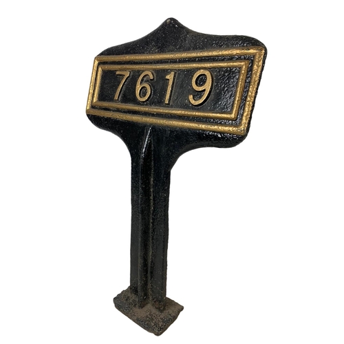 258 - A large late 19th century cast iron railway marker. 63cm.