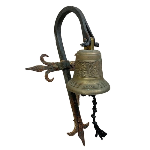 28 - Victorian brass and iron wall hanging bell. 30 x 48cm