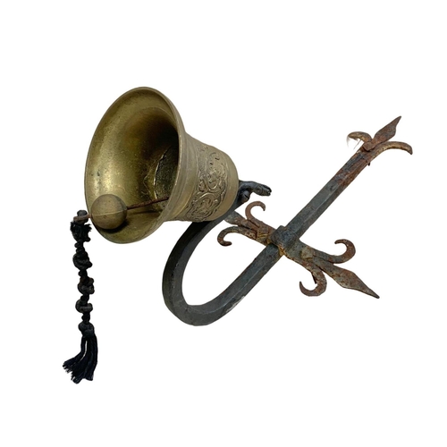 28 - Victorian brass and iron wall hanging bell. 30 x 48cm