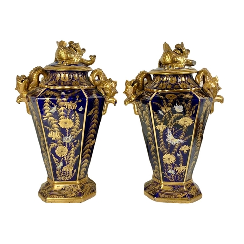 3 - Pair of large Victorian colt blue and gilt urns. With Chinese dragon design. 37 x 55cm