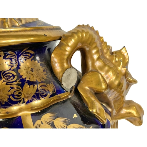 3 - Pair of large Victorian colt blue and gilt urns. With Chinese dragon design. 37 x 55cm