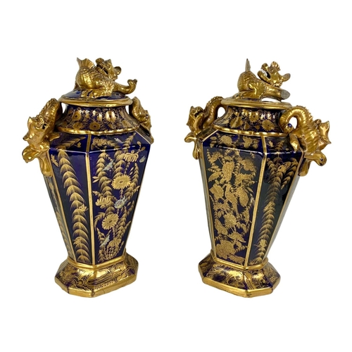 3 - Pair of large Victorian colt blue and gilt urns. With Chinese dragon design. 37 x 55cm