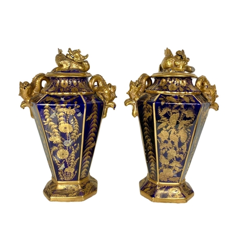 3 - Pair of large Victorian colt blue and gilt urns. With Chinese dragon design. 37 x 55cm