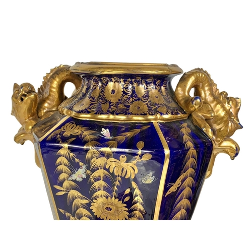 3 - Pair of large Victorian colt blue and gilt urns. With Chinese dragon design. 37 x 55cm