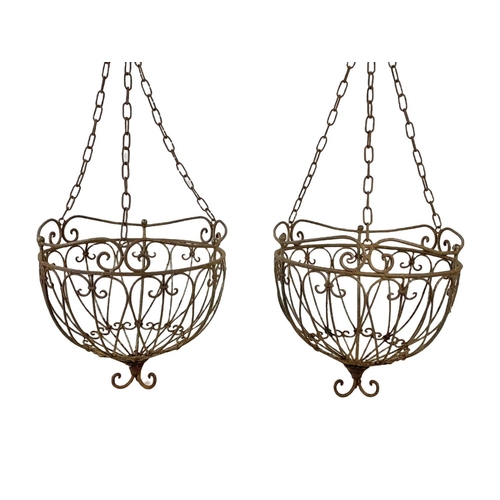 311 - A pair large iron hanging baskets. 37 x 79cm including chain.