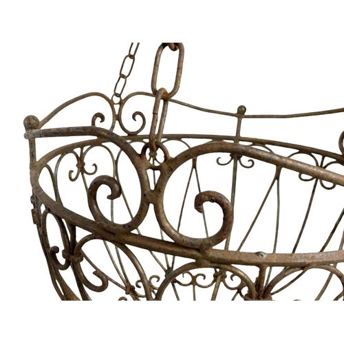 311 - A pair large iron hanging baskets. 37 x 79cm including chain.