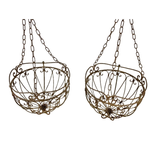 311 - A pair large iron hanging baskets. 37 x 79cm including chain.