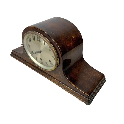 342 - A vintage mantle clock with key and pendulum. 51 x 24.5cm.