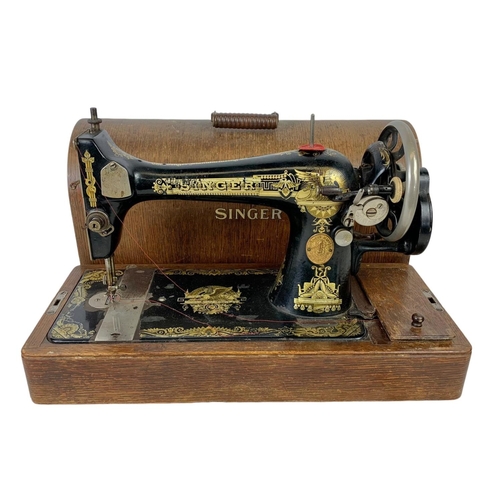 346 - An early 20th century wind up Singer sewing machine 51 x 34cm.