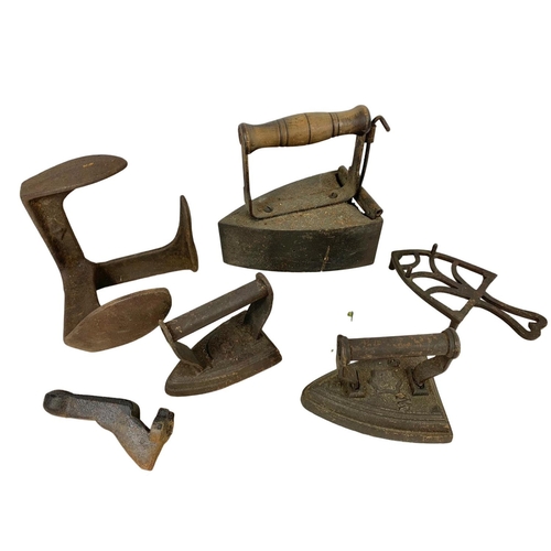 349 - Victorian irons, a shoe last and a vintage poker stand.