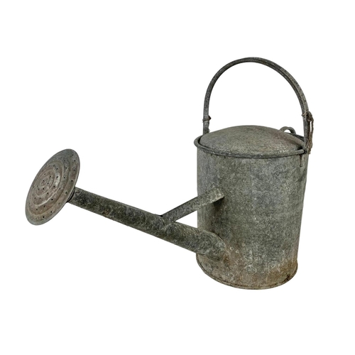 350 - A vintage galvanised watering can. 64 x 43cm