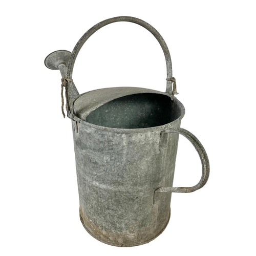 350 - A vintage galvanised watering can. 64 x 43cm