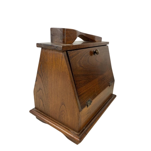 358 - A teak magazine rack and vintage shoe shine box with contents. 33 x 23 x 34cm.