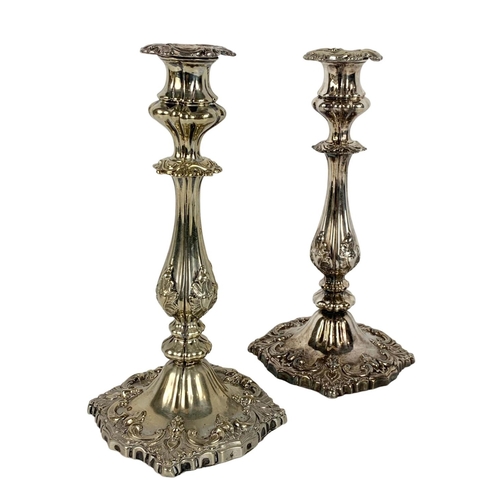 395 - Pair of tall early 20th century ornate silver plated candlesticks. 27cm