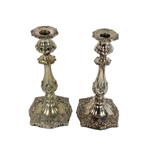 395 - Pair of tall early 20th century ornate silver plated candlesticks. 27cm