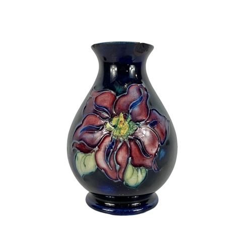 402 - 2 small pieces of vintage Moorcroft pottery. Vase and a bowl. Vase measures 9.5cm