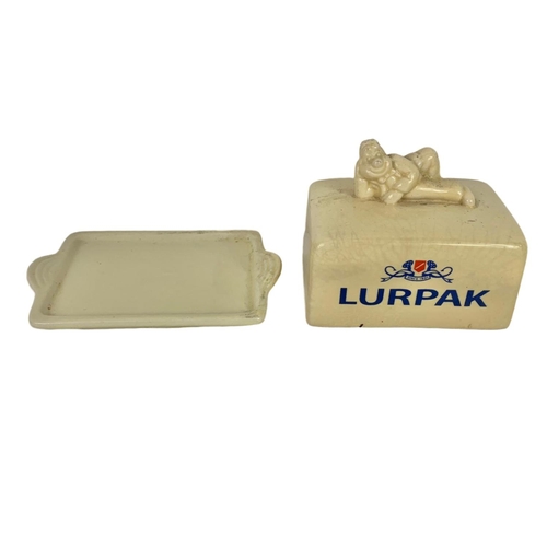 426A - 4 pieces of Lurpak pottery kitchenware. Including a butter dish, toast rack and 2 egg cups.