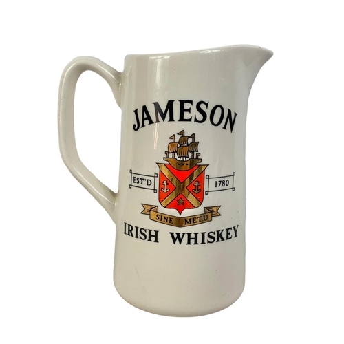 455 - A Carrigaline Pottery Co LTD Jameson Irish Whiskey water jug. 17.5cm