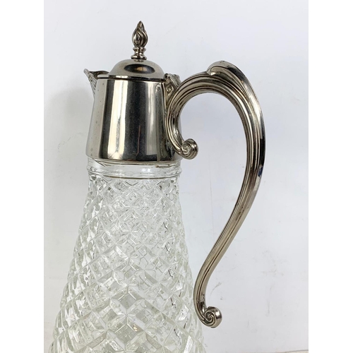 456 - Large vintage silver plated claret jug. 31cm