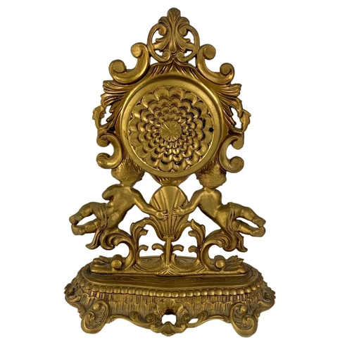 467 - Ornate gilt mantle clock with cherubs. 31 x 40cm.