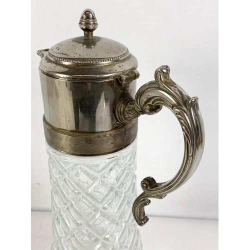 476 - Large vintage silver plated claret jug. 18 x 36cm