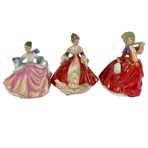 477 - 4 Royal Doulton pottery figurines. Top O’The Hill, Autumn Breezes, Southern Bell and Rebecca. Larges... 