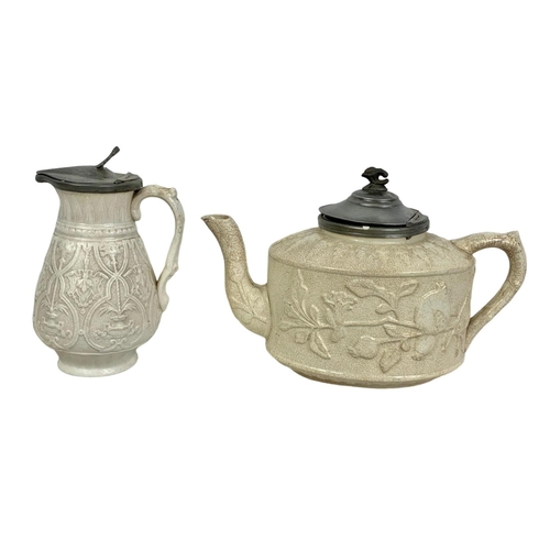 491 - 2 Victorian salt glazed teapots with with pewter lids largest 20 x 14cm