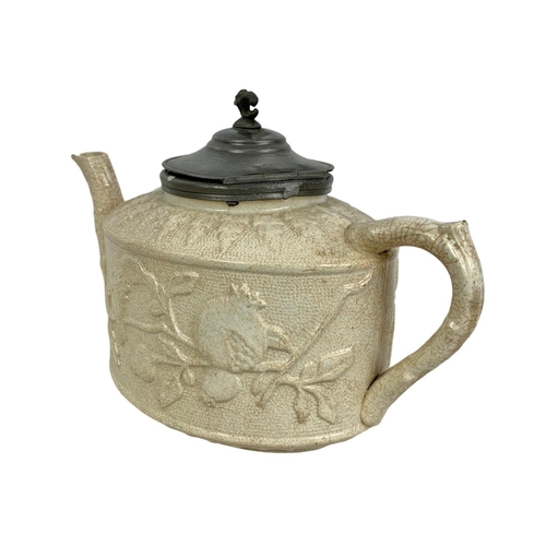 491 - 2 Victorian salt glazed teapots with with pewter lids largest 20 x 14cm