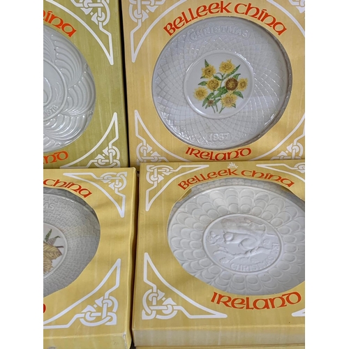 502 - 9 Belleek China Christmas plates in boxes. 1970’s and 80’s. 26cm