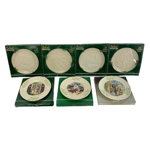 503 - 7 Belleek pottery Christmas plates in boxes. 23cm